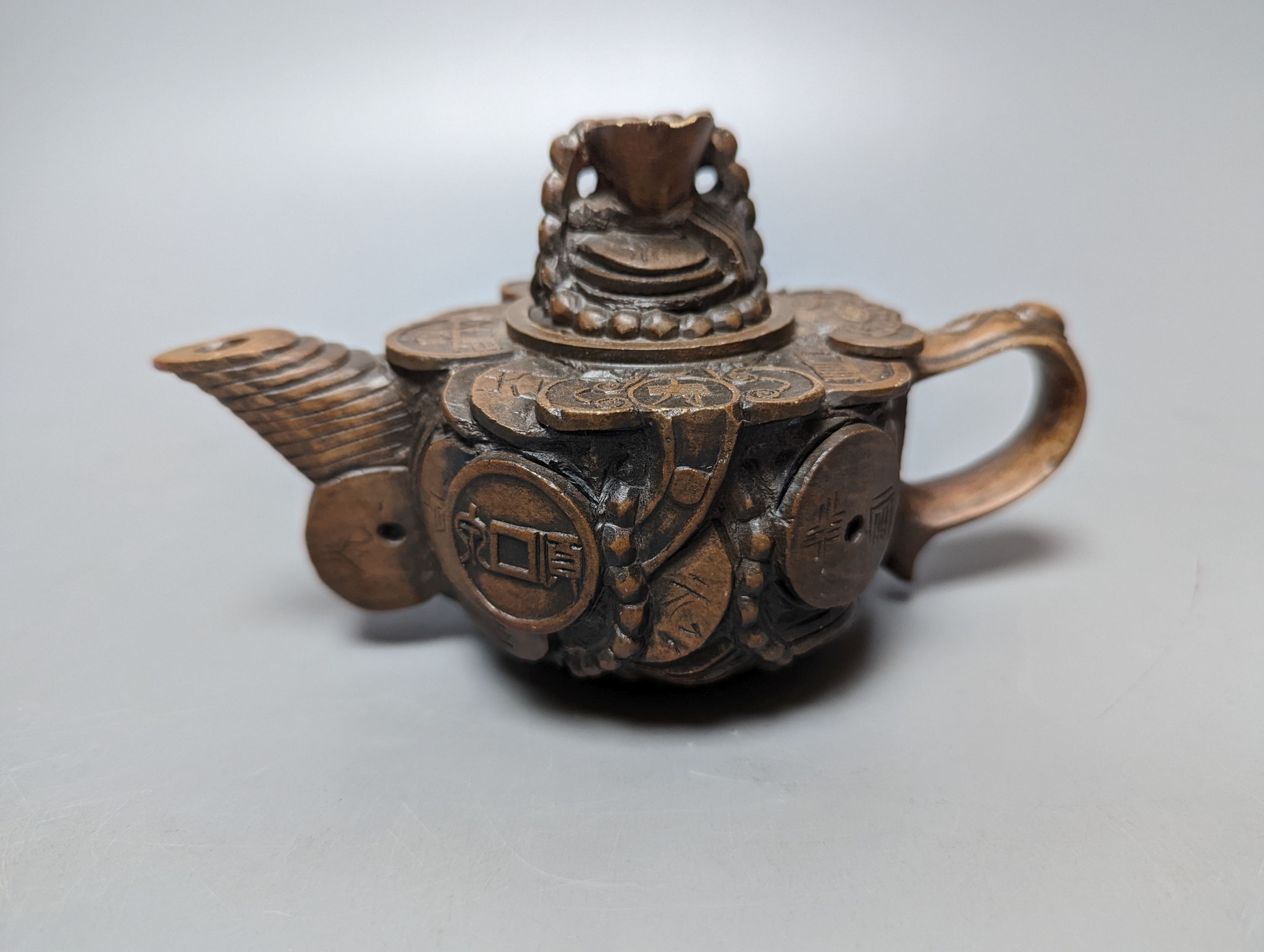 A Chinese stoneware 'cash' teapot and cover and five Yixing teapots (6)